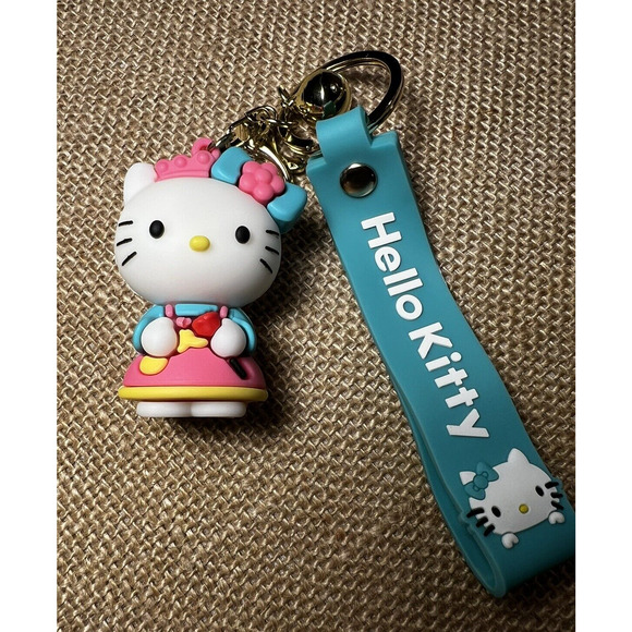 Hello Kitty (Sale in Japan Only) Teal Silicone Wristlet Key Chain & Jingle Bell - Picture 1 of 9